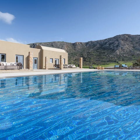 Glide through the silky seawater pool with a postcard-worthy backdrop