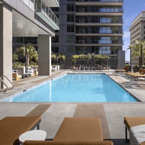 Spend sunny days relaxing by the shared rooftop pool