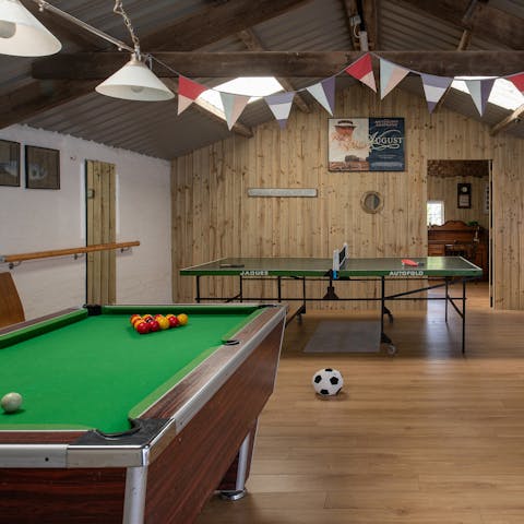 Play some pool, table tennis, or air hockey in the former cow shed