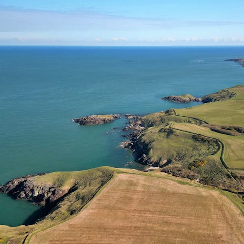 Explore the area, including the sandy beach at Traeth Porthor, 2 kilometres away