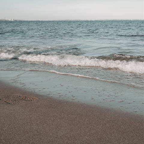 Spend the day sunbathing and swimming on Mastichari Beach