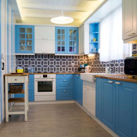 Rustle up a feast in the tiled kitchen using ingredients from the island, like local honey and fresh olives