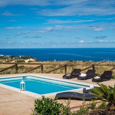Soak up the Sicilian sun from in or beside the private pool