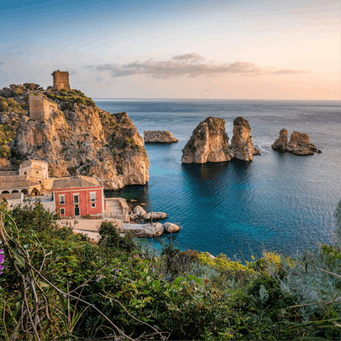 Visit the seafood markets and pristine beaches of Castellammare del Golfo
