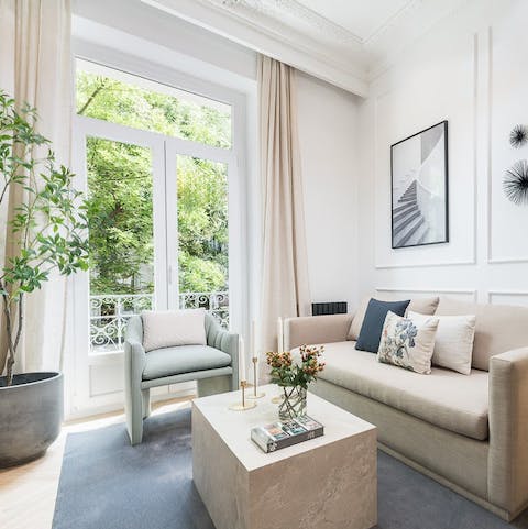 Take in the leafy views of the street from the Juliet balcony