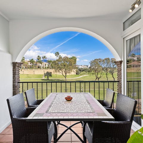 Enjoy a typical Spanish lunch on the balcony overlooking the golf course