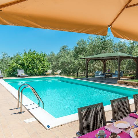 Plunge into the pristine swimming pool on a hot day