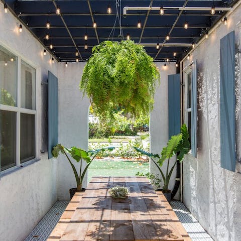 Have dinner under fairy-lights in the orchid garden