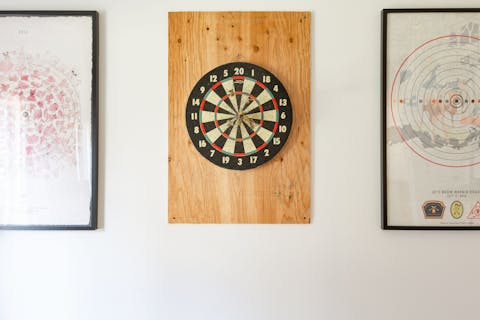 Challenge someone to a darts tournament
