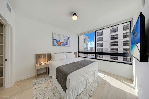 Wake up to city views through floor-to-ceiling windows
