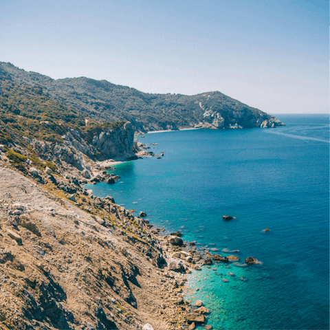 Explore secluded coves on the island of Skiathos
