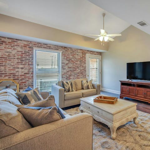 Feel the rustic vibes in the living room with its exposed brick wall
