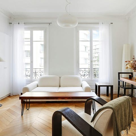 Have a glass of Champagne on the sofa, after a busy day in the City of Light