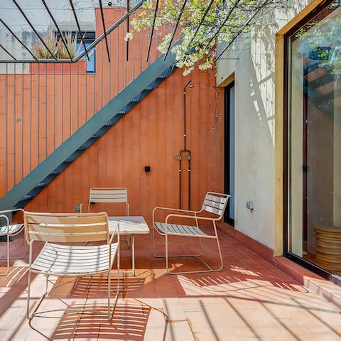 Dine under the shade of the vine-covered pergola