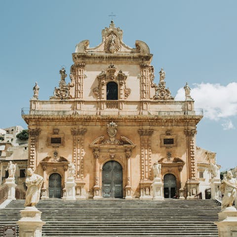 Discover Modica's Baroque church, an eleven-minute drive away