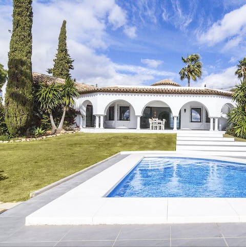 Set in a garden with towering trees