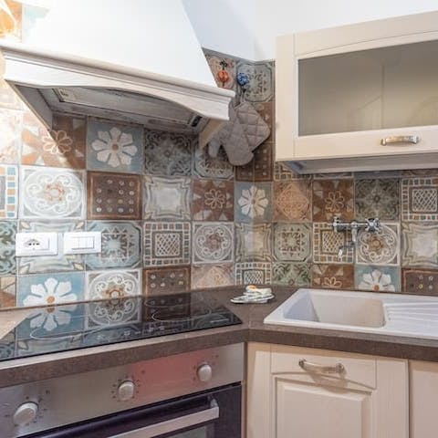 Knock up a southern Italian classic in the pretty, mosaic kitchen