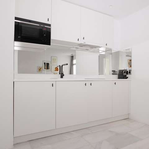 Fix yourself a Spanish-inspired snack in the sleek kitchenette