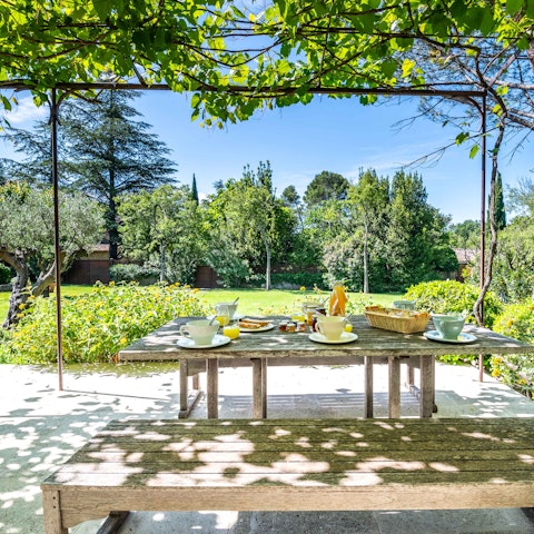 Feast on local cheese and fresh bread in the pretty gardens