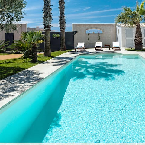Cool off in the pool before lounging next to it with a negroni in hand