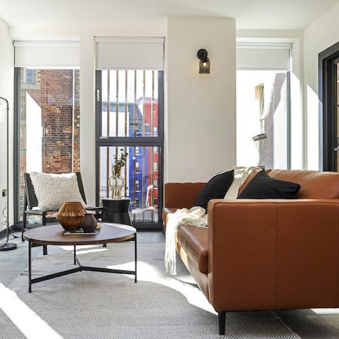 Kick back in the bright living room with a glass of wine after a day of sightseeing