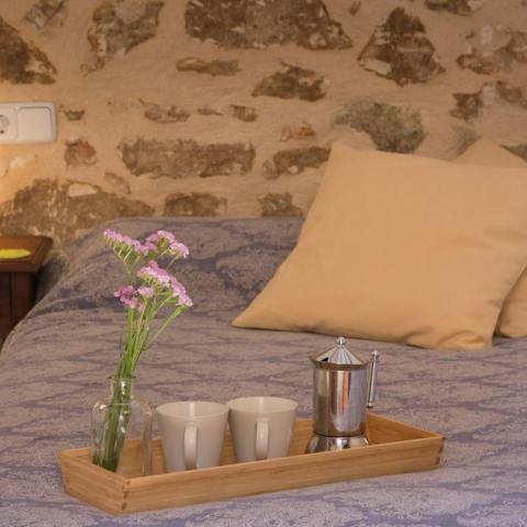 Enjoy your morning coffee in bed, surrounded by traditional ancient stone