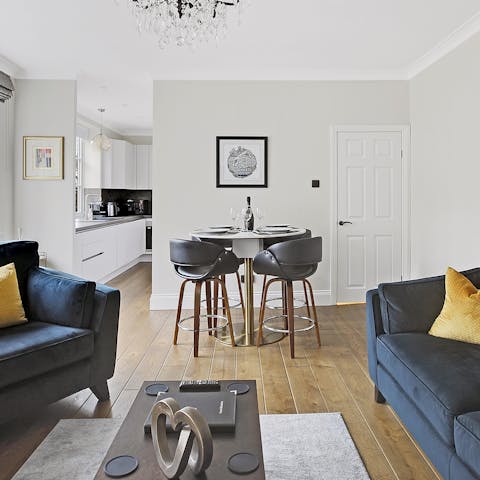 Relax on the sofas with a a gin and tonic or gather at the dining table for a chic soirée