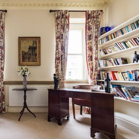 Grab a book from the shelves in the study