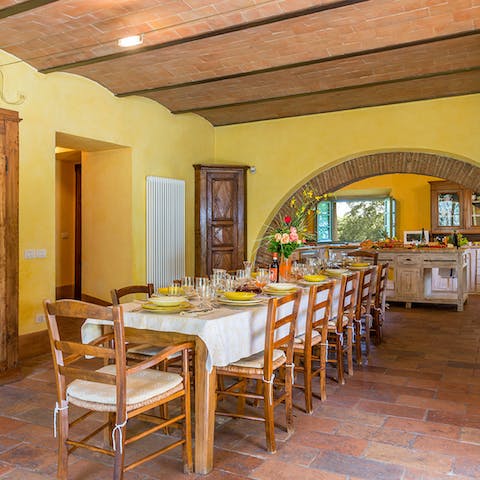 All eat together at the huge, rustic dining table