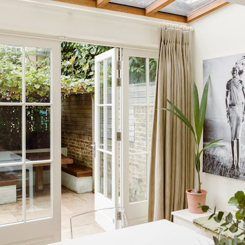 Step out into your private outdoor dining area from the comfort of the elegant living room