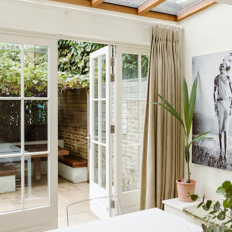 Step out into your private outdoor dining area from the comfort of the elegant living room