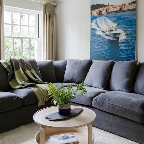 Kick back and relax in the plush lounge area, perfect for cosy movie evenings with your family and friends