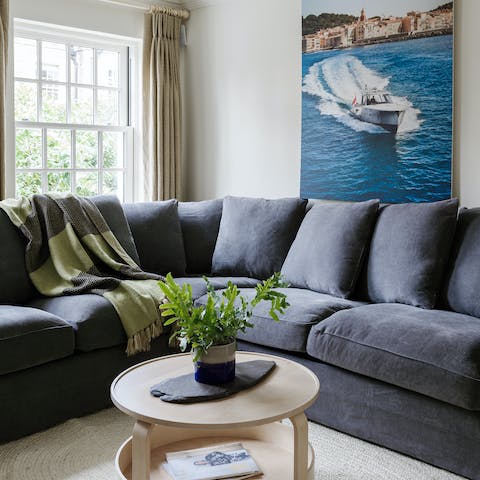 Kick back and relax in the plush lounge area, perfect for cosy movie evenings with your family and friends