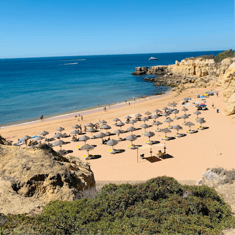 Stroll along 6km of golden sands at nearby Praia da Falesia