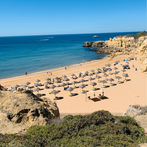 Stroll along 6km of golden sands at nearby Praia da Falesia