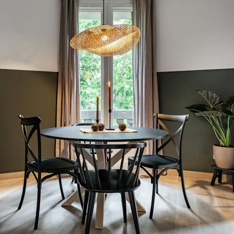 Dine in front of the French doors with leafy street views
