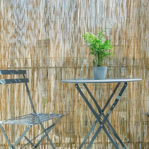 Relax on the private balcony with a glass of Greek wine