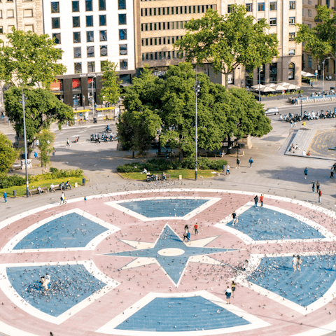 Stroll around bustling Plaça de Catalunya, six minutes away on foot