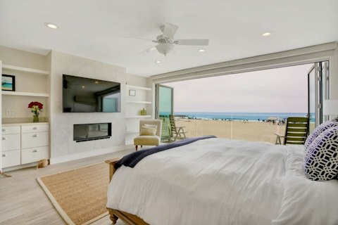 Wake to open ocean views steps from the sand