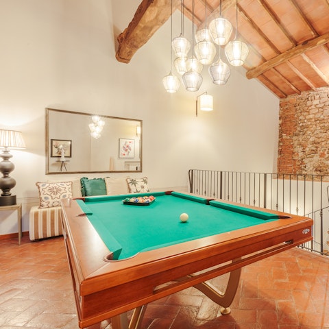Get competitive with a game of pool in the upstairs lounge