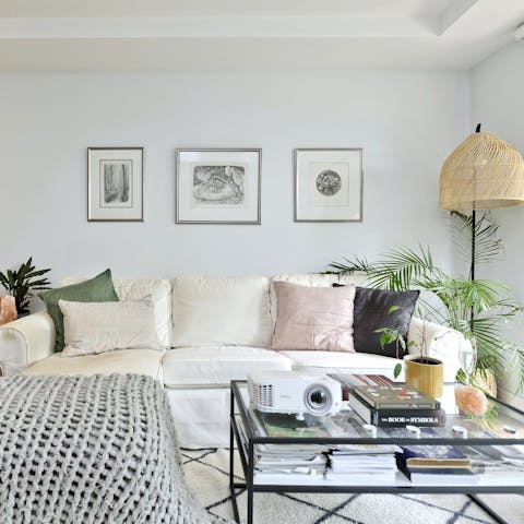 Get cosy on the sofa and screen a film on the projector