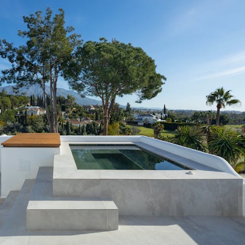 Enjoy incredible views while soaking in the Jacuzzi