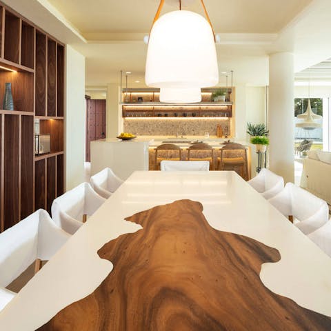 Gather together around the designer dining table inside