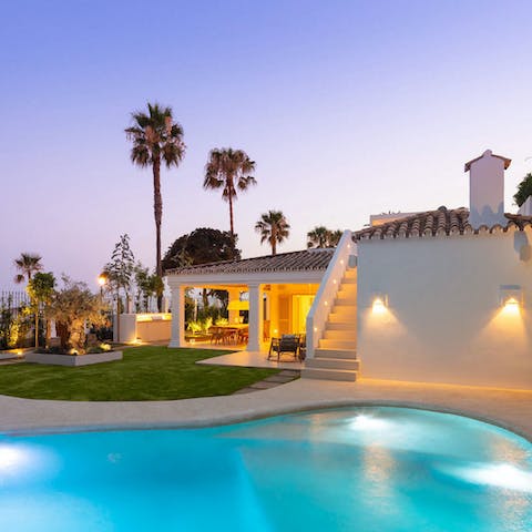 Enjoy an evening swim in the lagoon-shaped pool