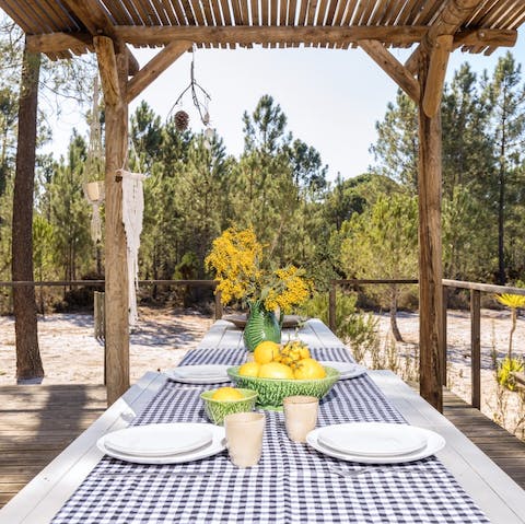 Gather around the rustic banquet-style table for relaxed dinners, drinks, and card games at home