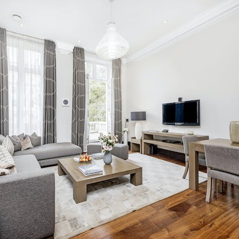 Open up the living room's French doors and step out onto the balcony with your morning coffee