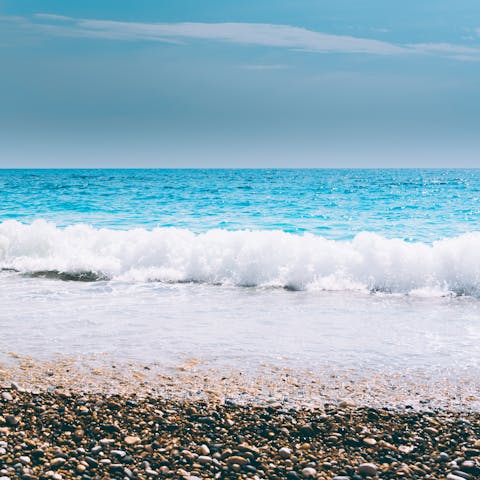 Watch the waves lap the shore at Maleme Beach, a five-minute drive away