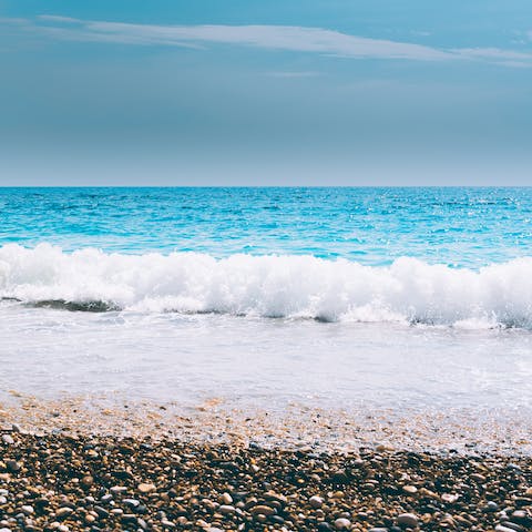 Watch the waves lap the shore at Maleme Beach, a five-minute drive away