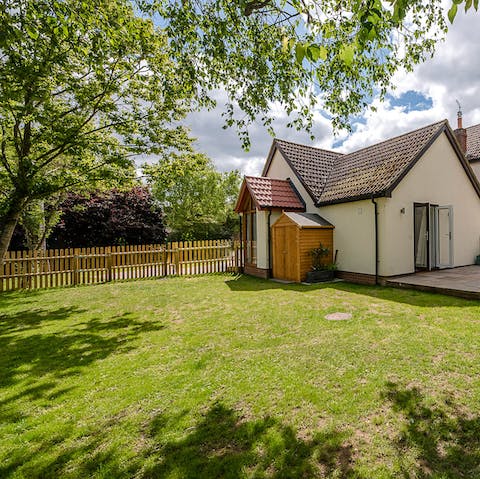 Lounge on the grass or have a kickabout in the large, tree-covered garden