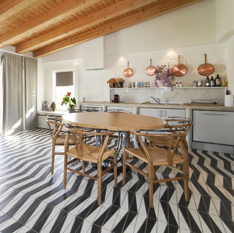 Cook up traditional Italian pasta dishes and tuck in around the dining set